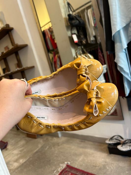 MIUMIU yellow ballerina flats