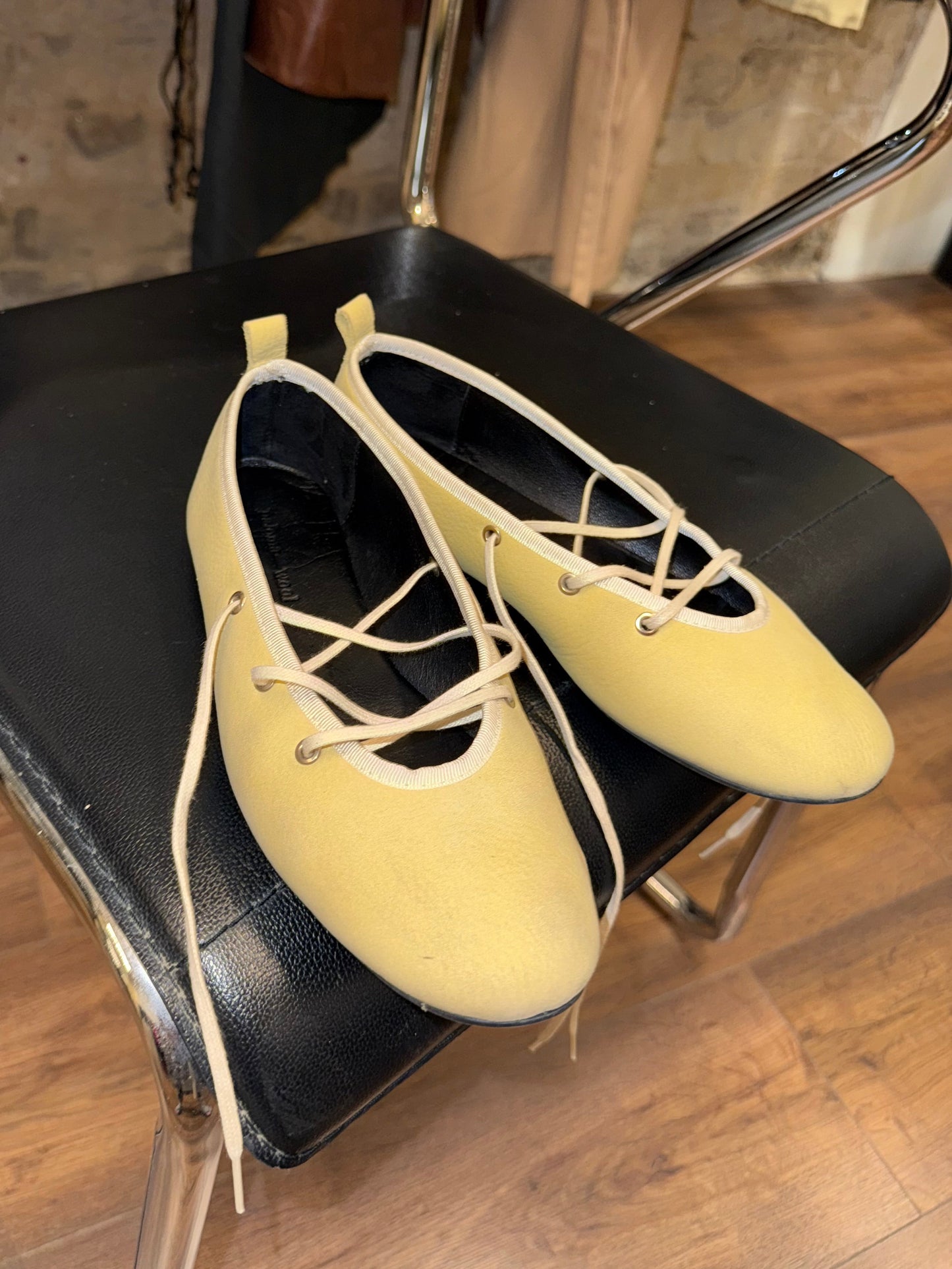 Paloma Wool — soft lemon leather wrap-flats